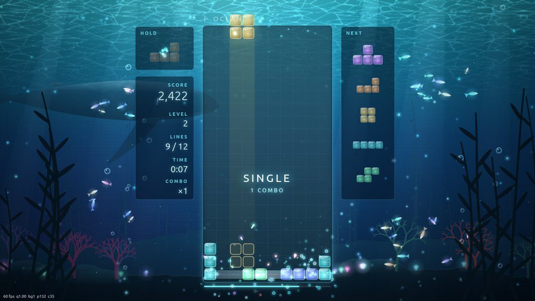 Ocean stage: whale and glowing fish around the playfield